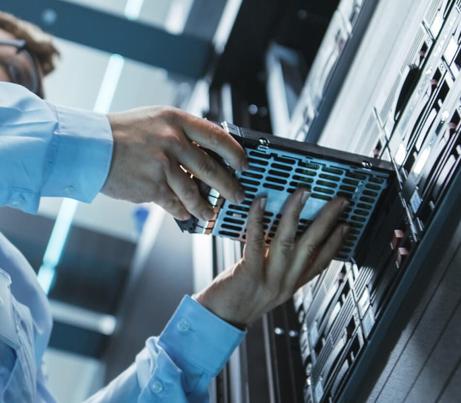 Male professional working in a server room