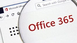The Microsoft Office 365 logo under a magnifying glass