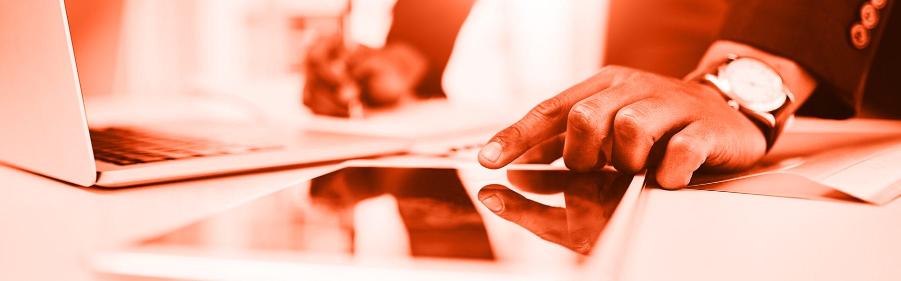 Close-up of two men reviewing calculations at a desk