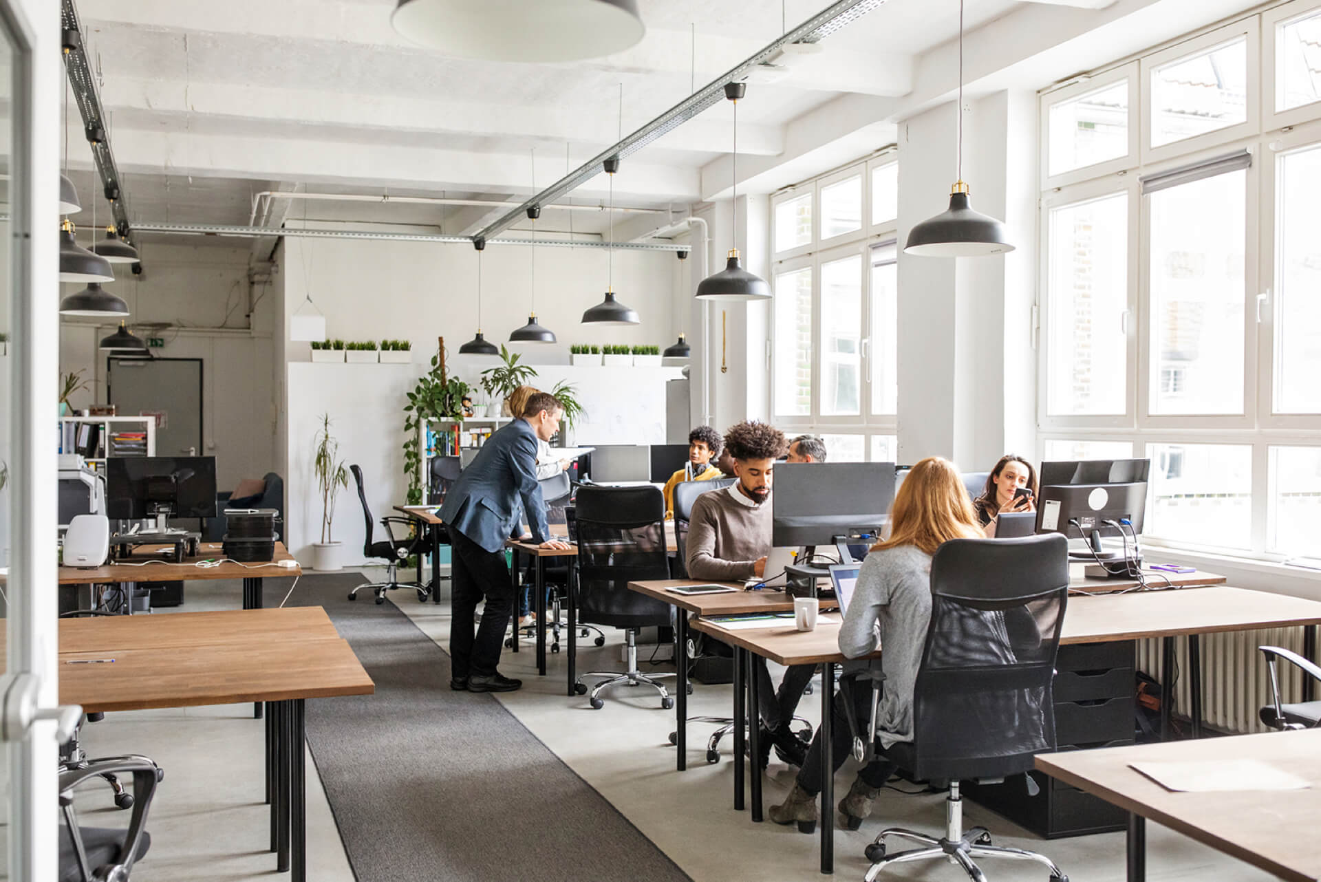 Open plan office with employees working at desks