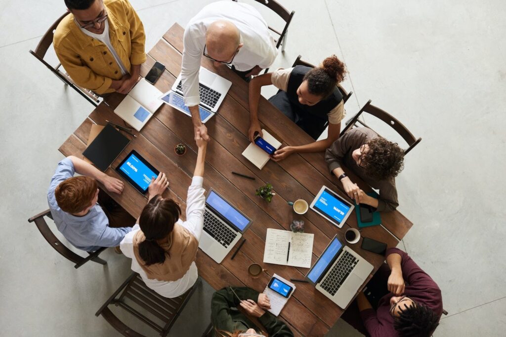 people around conference table for meeting