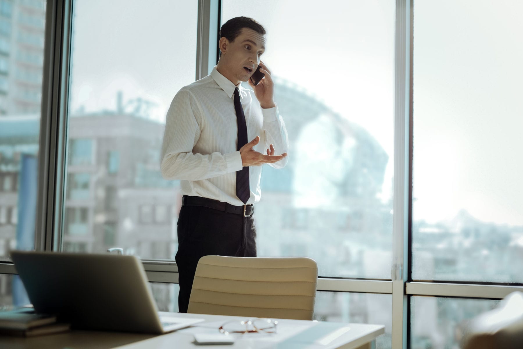 Handsome businessman negotiating on the phone