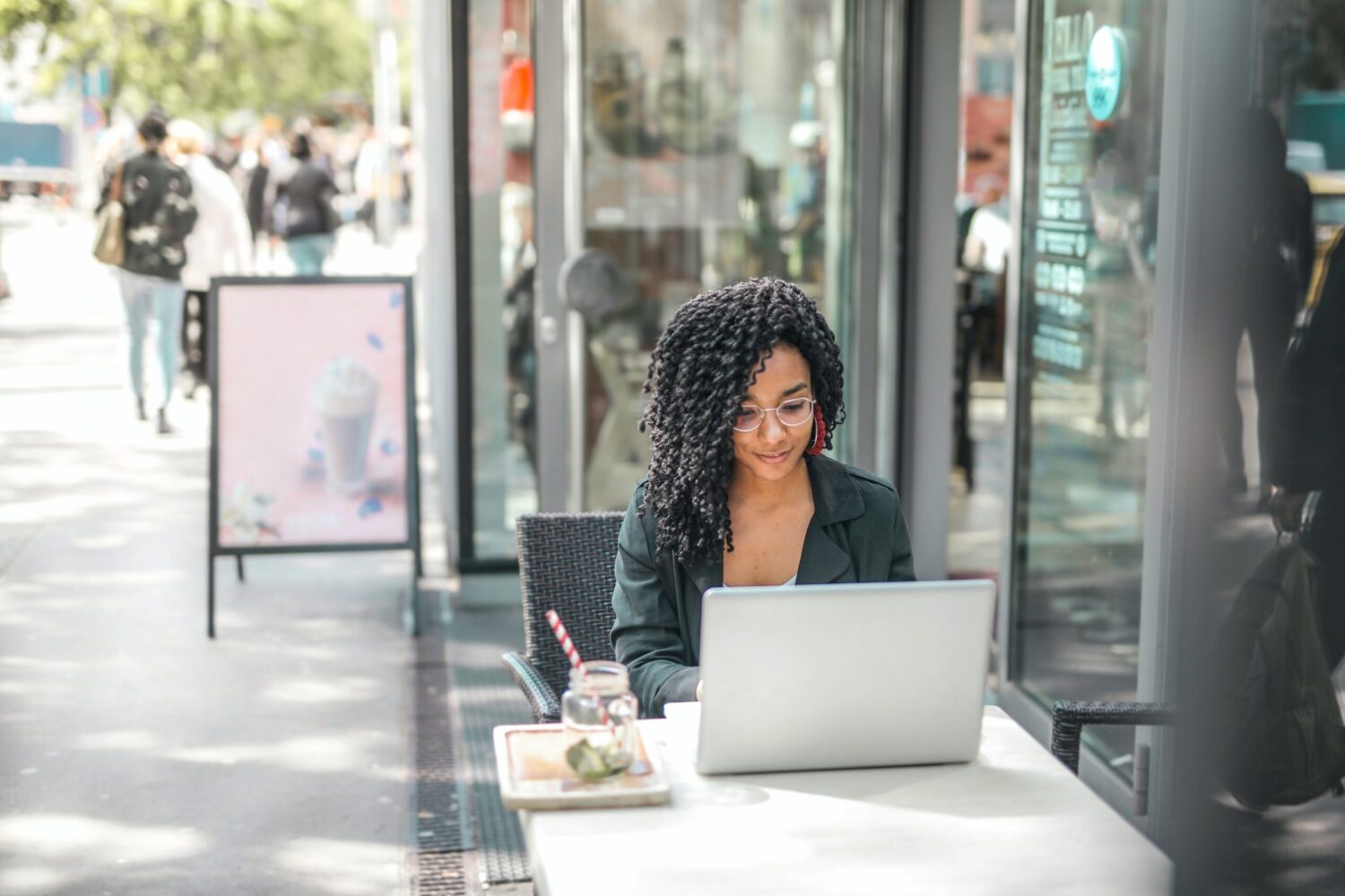 woman working on her laptop outdoors