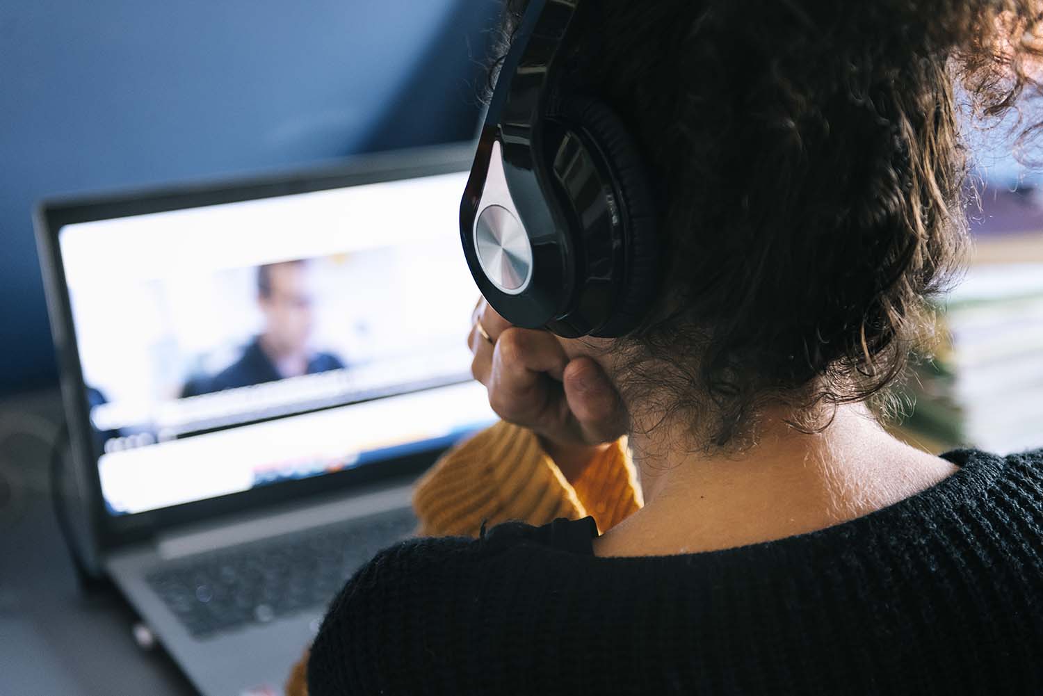 woman-looking-at-video-chat-on-laptop