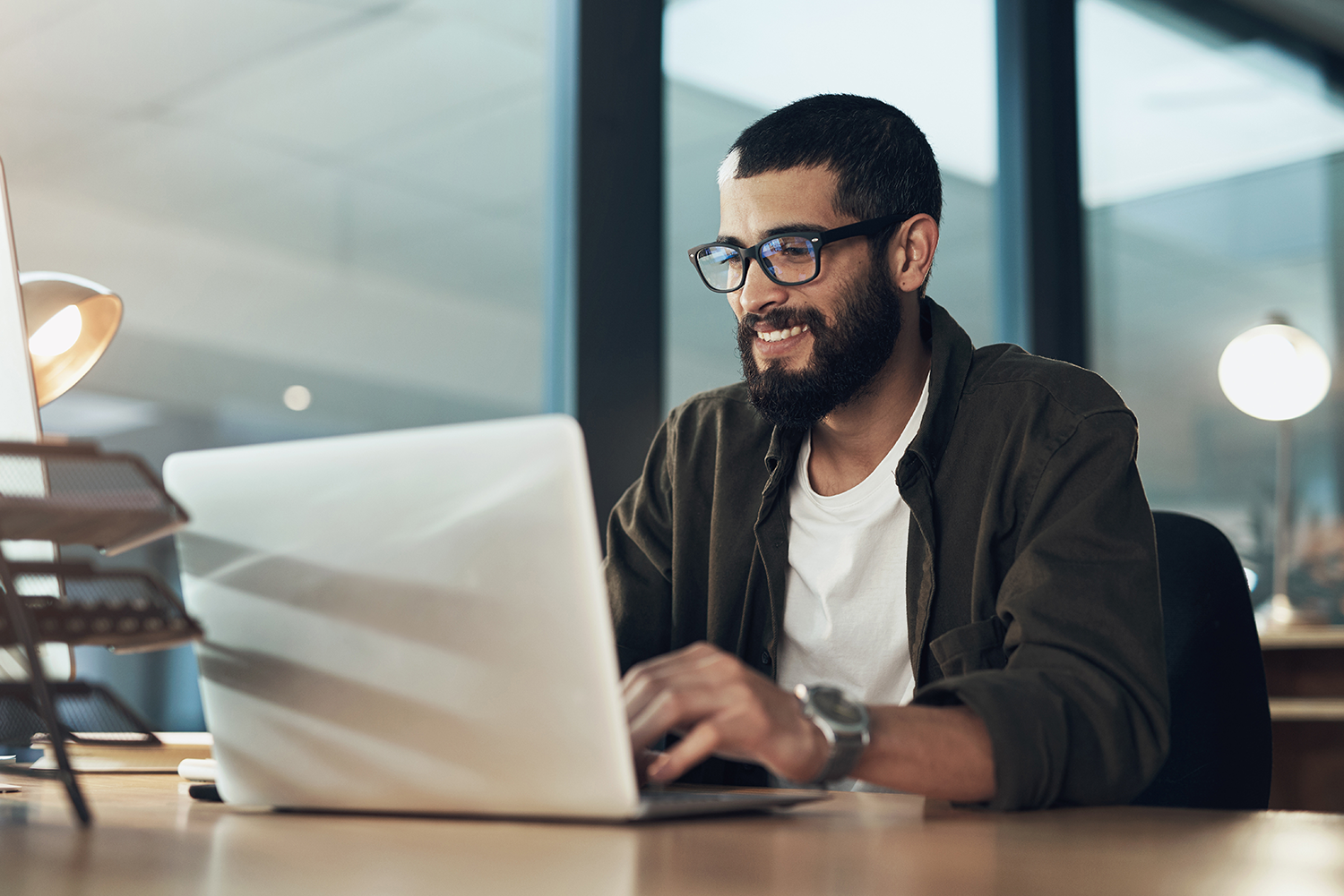 man-at-desk-using-laptop