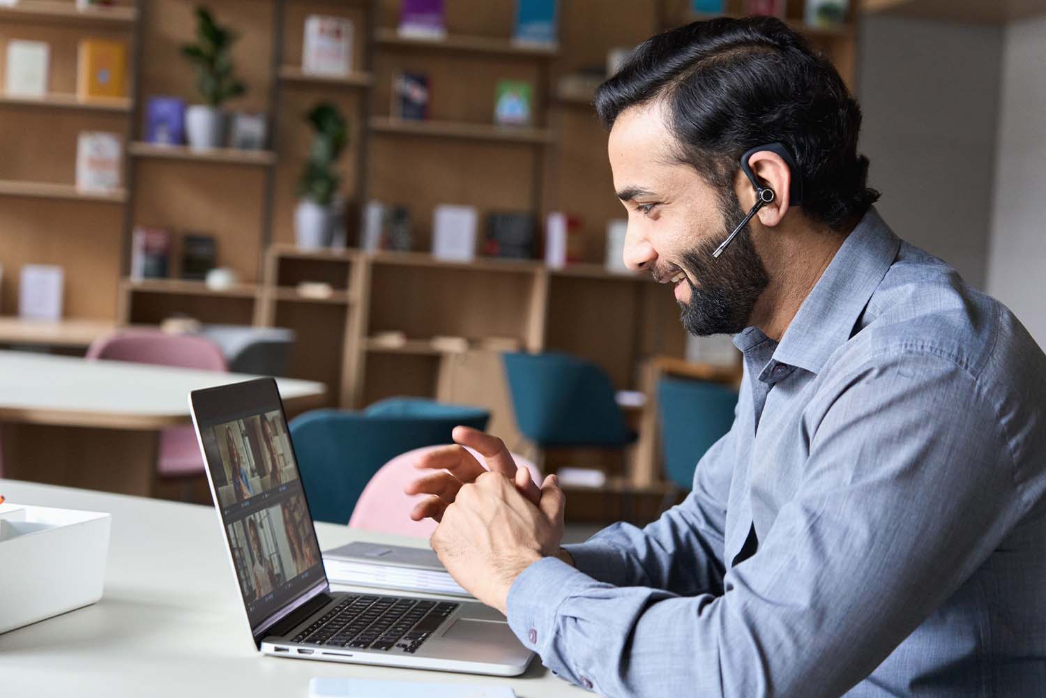 man on video call on laptop