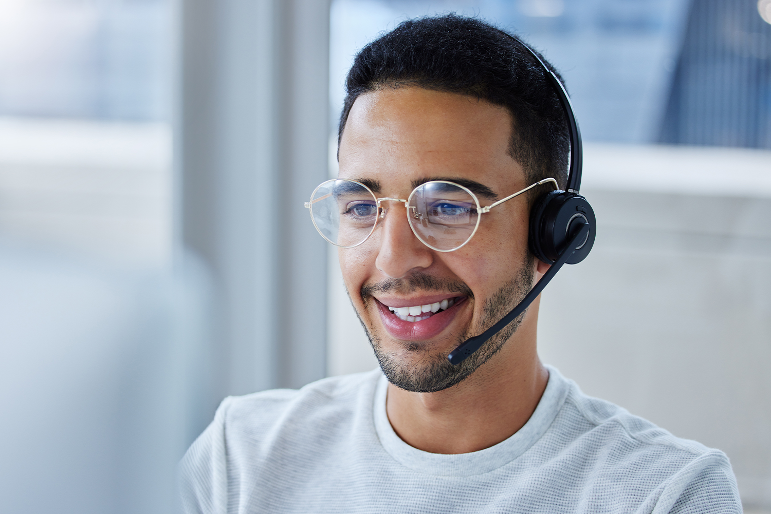 man_smiling_with_headset