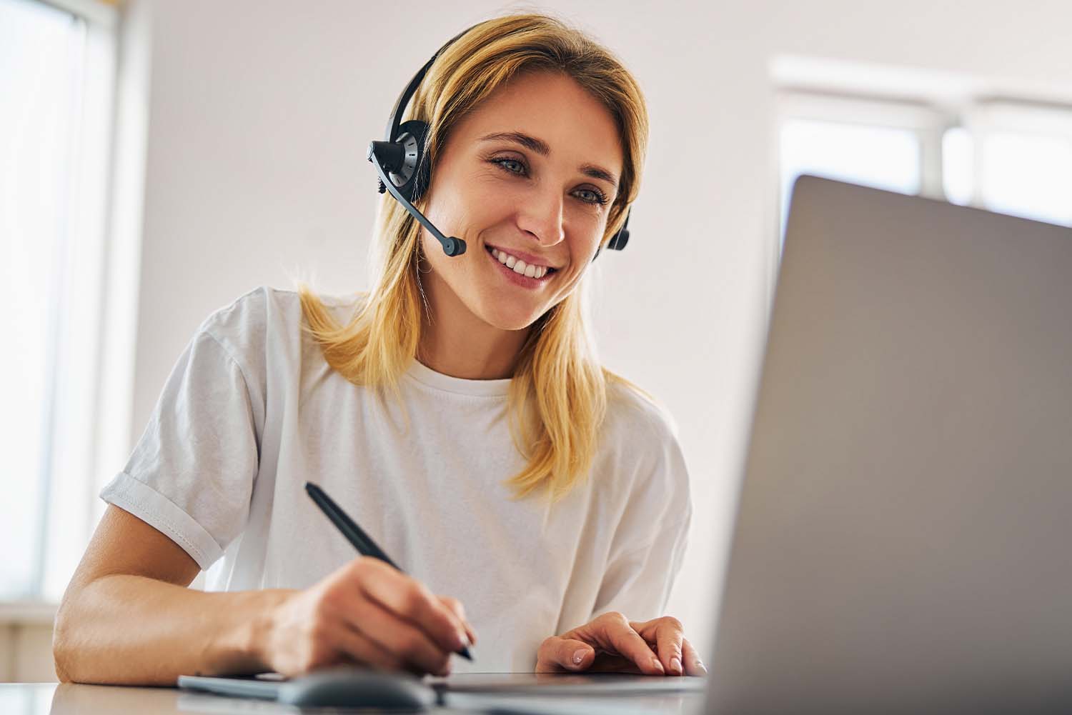 woman-on-headset-in-front-of-laptop